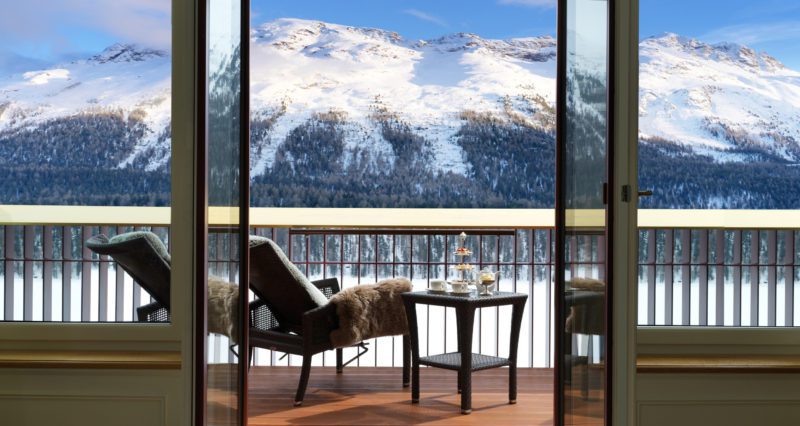 mountain view with reclining chairs and table
