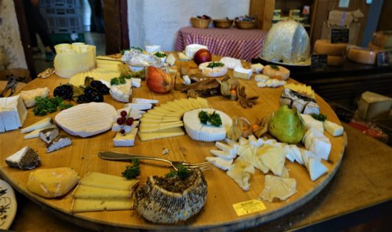 large cheese charcuterie board on round table