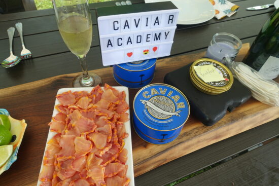 cropped caviar academy with jars and wine