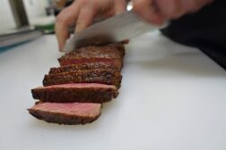 cutting steak closeup on white table